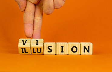 Vision or illusion symbol. Businessman turns wooden cubes and changes the word 'vision' to 'illusion'. Beautiful orange table, orange background, copy space. Business and vision or illusion concept.