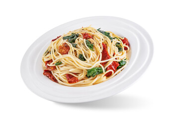 Dried tomato spinach Pasta on a white isolated background