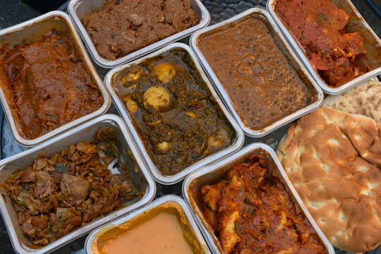 Michelin star curry at home with Hyderabadi milk loaf and unleavened flatbread North Indian style chicken stewed king cabbage spicy paneer black lentils spinach marinated cod dry beef and dices mutton