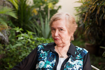 grandma in the garde, old lady in the garden, old lady smiling