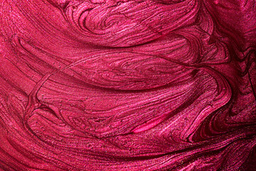 Red pink enamel nail polish texture background. Makeup varnish sample abstraction