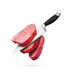 Pieces of raw beef steaks with knife