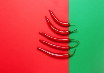 Red hot chili pepper on a red and green background