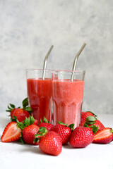 Fresh strawberry banana smoothie in a tall glasses.