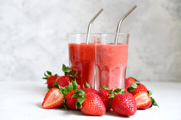 Fresh strawberry banana smoothie in a tall glasses.