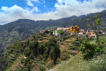 Fototapeta na wymiar colorful village on top of the mountain, living from terraced cultivation in Madeira Island