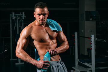 Fototapeta na wymiar Stay hydrated concept. Weightlifter gym man preparing for training. Muscular athletic body. Sport health. Proper nutrition.