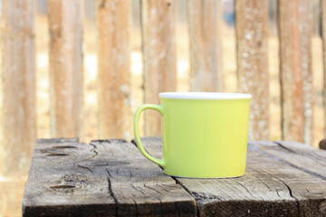 Green ceramic tea cup for outdoor camping picnic.