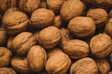 Walnuts which scattered on painted pine board surfaces.