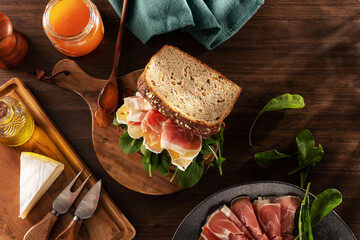 Parma ham sandwich with brie cheese and apricot jam
