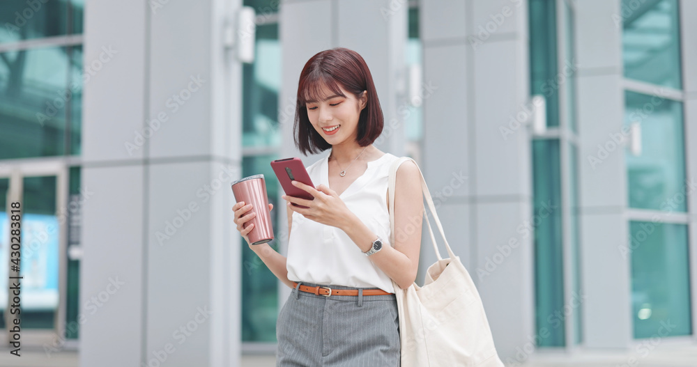 Wall mural businesswoman use smart phone