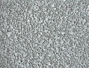 abstract uneven textured concrete wall, stone material texture closeup