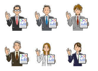 データ表示されたタブレットPCを手に持ちOKのサインを出すスーツ姿の男女
