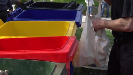 Colorful bins for sorting garbage on the street. Collection, recycling and reuse of plastic, glass, paper and metal waste, tin cans. Sustainable waste management system