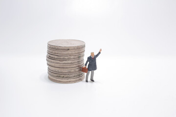the Increasing coins and mini businessman on the board