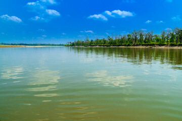Landscape with a river. The scenic view of the wide river, Jia- Bhorali, a tributary of the Brahmaputra river, at Nameri national park, Assam, India.