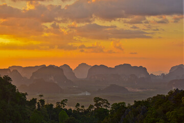 A Beautiful sunset forest , birds eye view use the drone in evening . Landscape with top of Tiger Cave temple, Wat Tham Suea, Krabi region, Thailand.