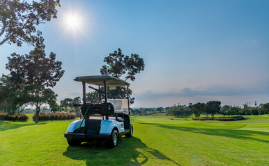 Golf cart on golf course, parking on fairway. Equipment and golf club bag are put in ready for...