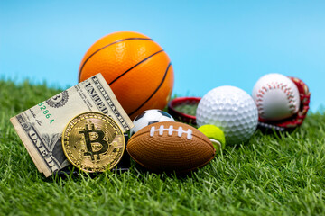 Bitcoin with American football tennis ball golf basketball on green grass