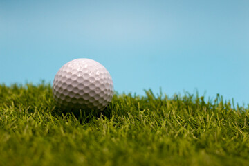 Golf ball is on green grass
