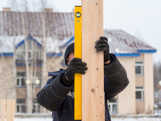 Portrait of an installer with a level in hand