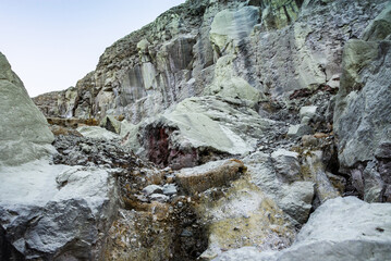 Rock wall and sulphur mining in Ijen crater in the morning in Kawah Ijen volcano Landmark from East Java Indonesia