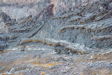 Rock wall and sulphur mining in Ijen crater in the morning in Kawah Ijen volcano Landmark from East Java Indonesia
