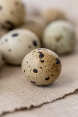 Obraz premium Still life. Quail eggs on a textile napkin. Rustic. Easter celebration concept.