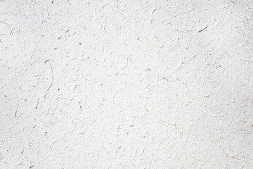 Obraz premium White textured paper background made of elephant poo. Colorful natural material wallpaper and background. Eco friendly materials in sustainable concept. White and textured cover and background.