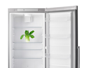 Fresh Chinese cabbage in empty fridge on white background
