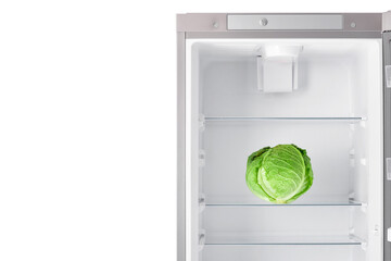 Fresh cabbage in empty fridge on white background