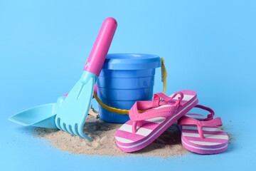 Set of beach accessories for children on color background