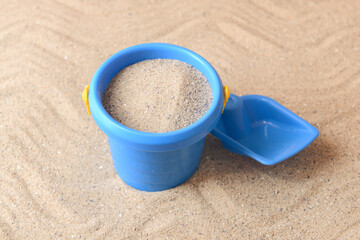 Fototapeta na wymiar Toy bucket and shovel for children on sand