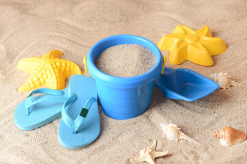 Fototapeta na wymiar Set of beach accessories for children on sand