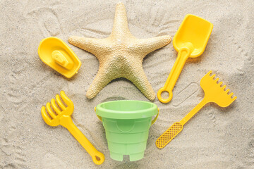 Fototapeta na wymiar Set of beach toys for children on sand