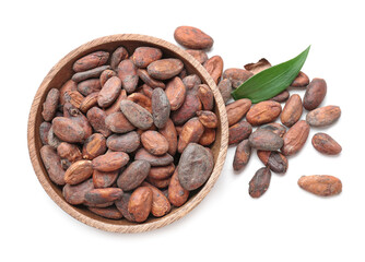 Bowl with cocoa beans on white background