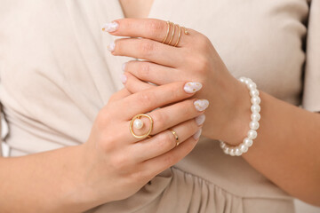Young woman with beautiful manicure and accessories, closeup