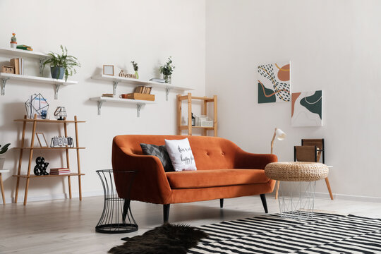 Stylish interior of living room with comfortable sofa