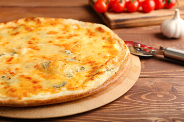 Board with tasty cheese pizza on wooden background