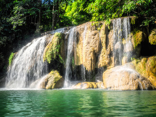 Fototapeta na wymiar The beautiful waterfall in forest at Erawan National Park.