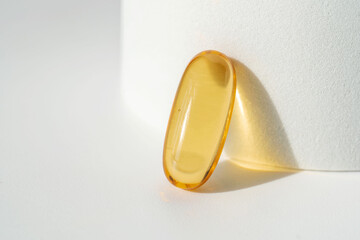 Oil filled capsules on the white background