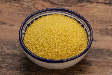 Raw cous cous heap in the bowl