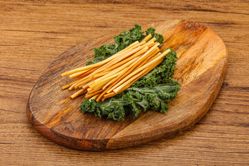 Chechel cheese sticks over board