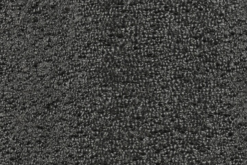 Black foam plastic background texture. black background for designers. dark styrofoam