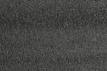 Black foam plastic background texture. black background for designers. dark styrofoam