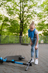 Electric scooter accident - girl suffering of pain after knee injury