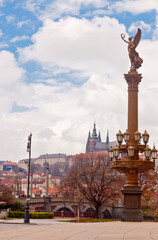 Rudolfinums column in Prague with St. Vitus cathedral in background, Czech Republic.