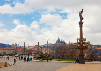 Obraz premium Rudolfinums column in Prague with St. Vitus cathedral in background, Czech Republic.