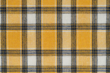 Yellow white tartan texture background. shirt fabric with a checkered pattern. factory material