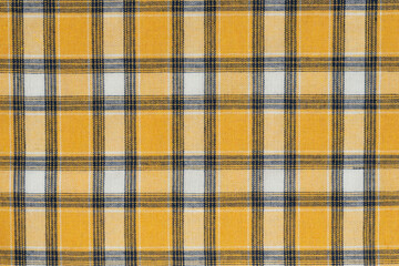 Yellow white tartan texture background. shirt fabric with a checkered pattern. factory material